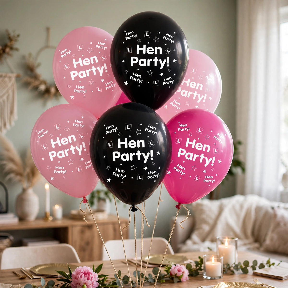 Hen party balloons in pink and black decorating a celebration venue