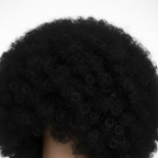 Close-up detail of Giant Black Afro Wig showing curly black fibre texture and density