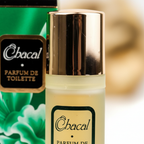 Extreme macro close-up of Chacal pale golden glass bottle texture and metallic gold cap — showcasing premium material quality