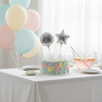 Silver foil birthday candles displayed on a decorated birthday party table with natural window light