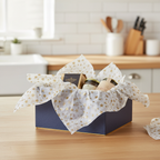 Luxury gift hamper lined and overflowing with white gold star tissue paper, warm natural light, premium gifting presentation