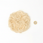 613 Daisy platinum blonde curly messy hair bun flat lay beside a £1 coin on white background showing product size and scale