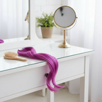Fuchsia Stargazer hair extension draped on vanity dressing table with natural window light, interior lifestyle shot