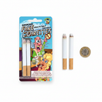 Fake joke cigarettes and blister pack flat lay on white background with pound coin for scale