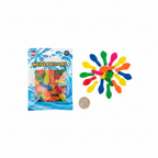 Flat lay of mixed colour water balloons beside a £1 coin on white background showing actual balloon size
