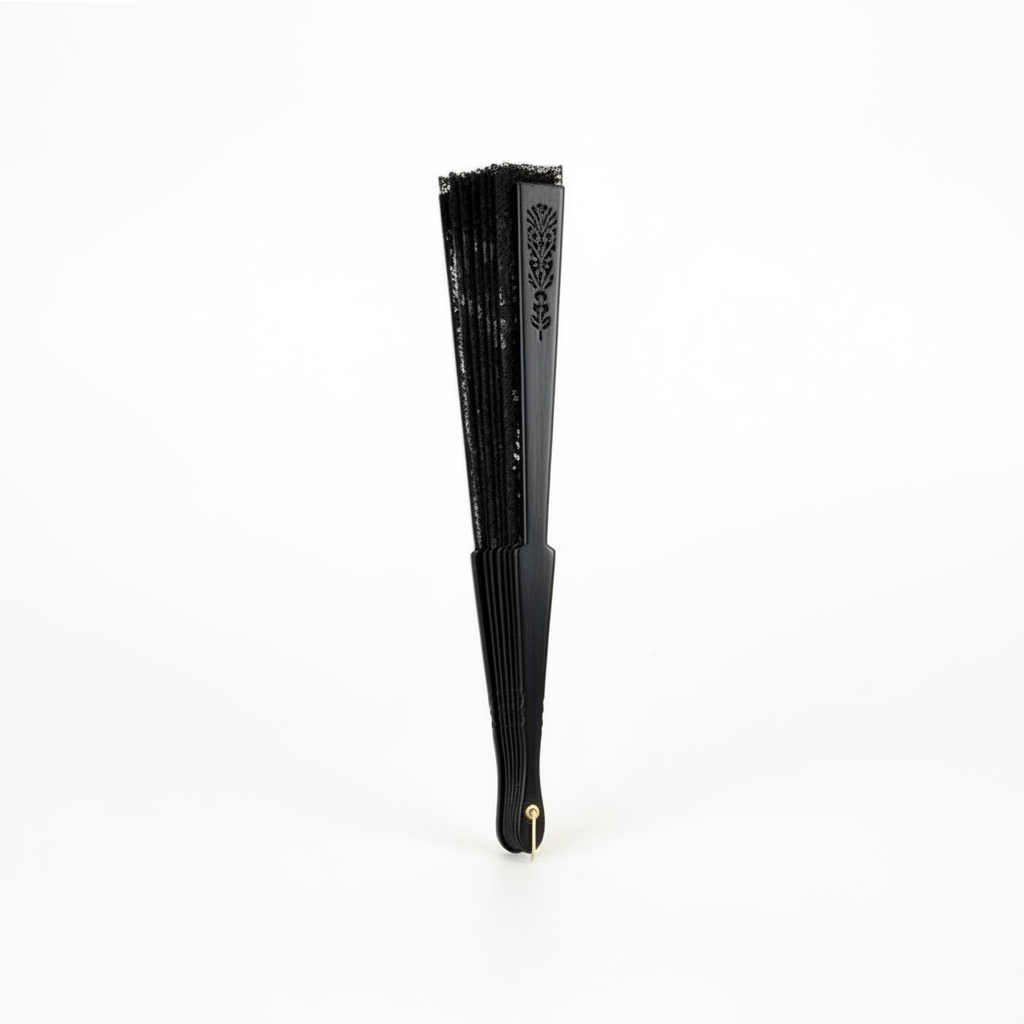 Black lace hand fan fully closed and folded showing slim elegant profile
