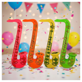 Inflatable Saxophones in assorted colours displayed against a vibrant party background with confetti and balloons