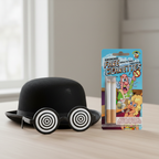 Funnyman fake cigarettes blister pack on wooden table with comedy props, natural window light