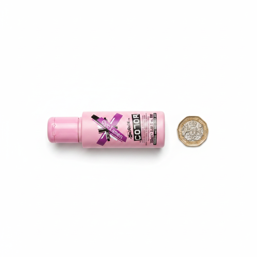 Crazy Color Cyclamen No.41 100ml bottle beside a UK £1 coin showing product size on white background