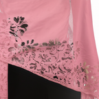 Close-up detail of soft pink lace floral pattern and tassel fringe on evening pashmina shawl