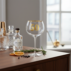 Art Deco 50th Birthday Gin Glass styled on a home bar shelf with botanical props and natural window light