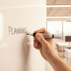Candid shot of hand writing on whiteboard with Swift marker, 85mm bokeh background, warm colour grade