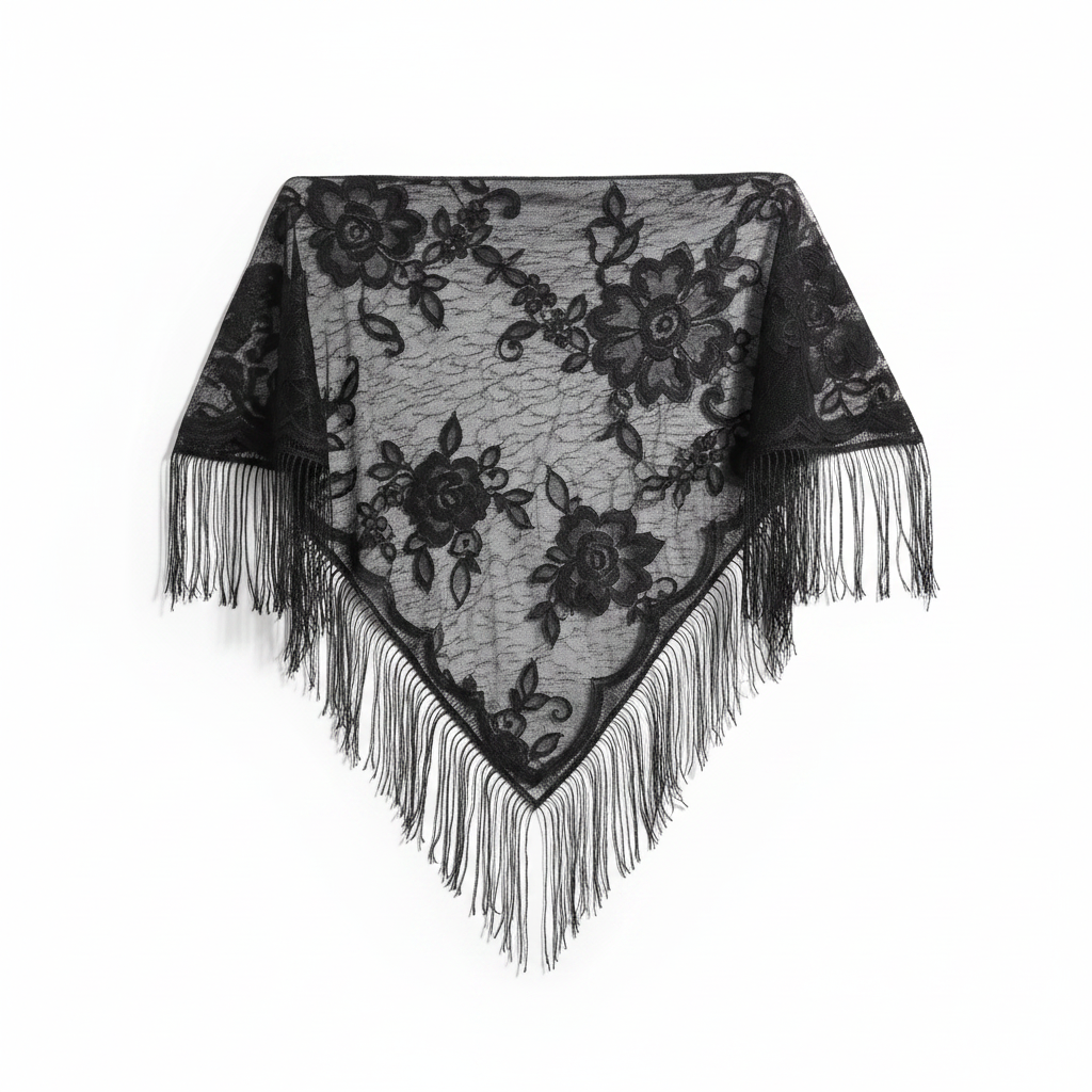 Black sheer lace triangle shawl with floral embroidery and long tassel fringe elegantly draped on white background, studio product shot