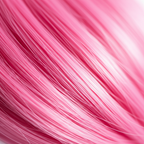Extreme macro close-up of hot pink Stargazer hair extension strands showing silky texture and finish