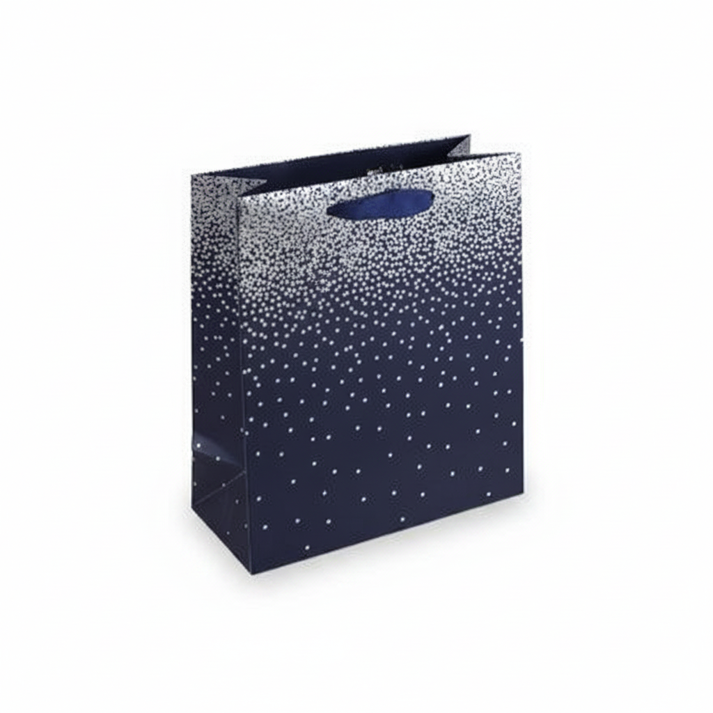 Navy ombre medium gift bag with metallic silver dot pattern and navy cord handles on white studio background