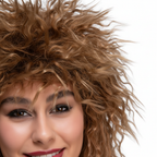 Extreme macro close-up of 80s Tina Brown Wig showing warm brown curl texture and synthetic fibre detail