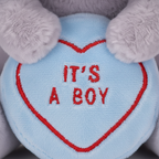 Close-up macro detail of the soft plush fabric and Love Heart branding on the Swizzels It's A Boy bunny toy