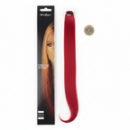 Stargazer Baby Hair Extension red clip-in strand laid flat beside a £1 coin on white background to show length and scale