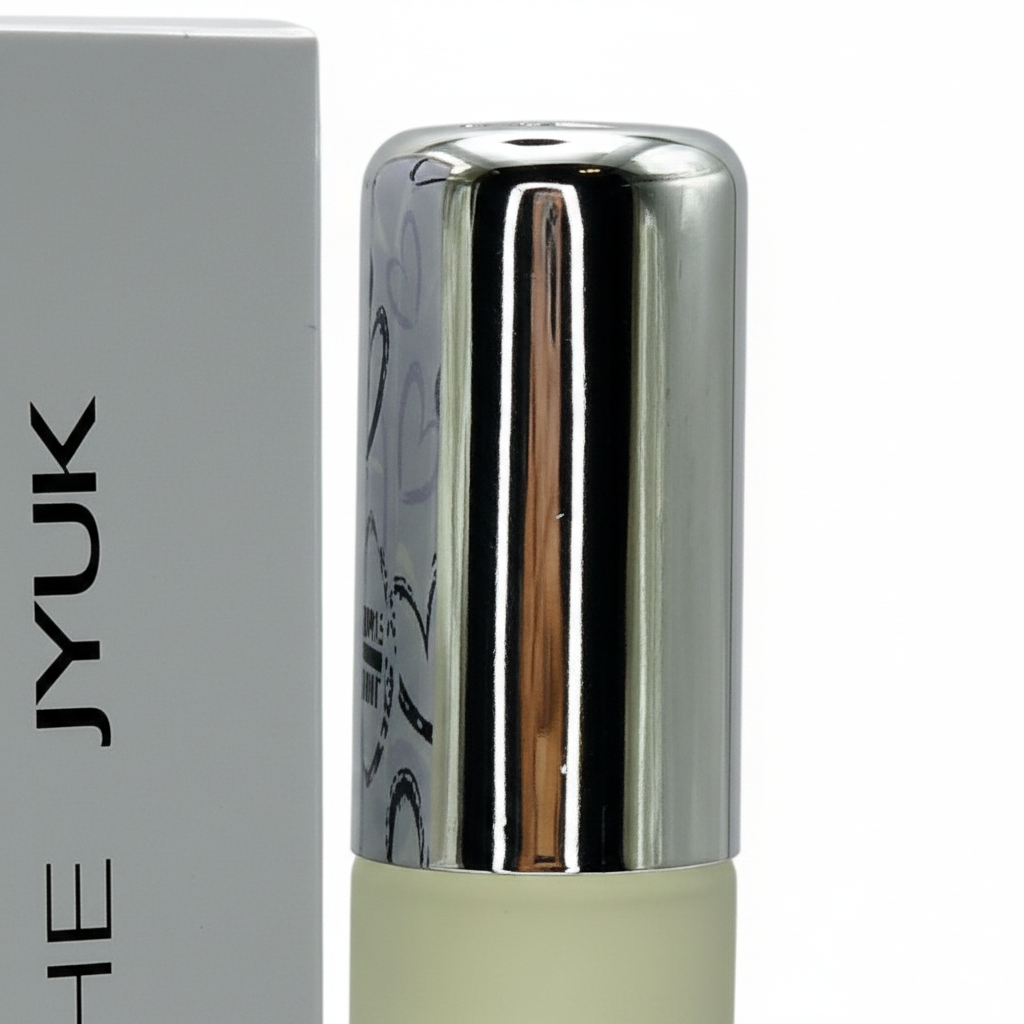 Extreme macro close-up of Milton Lloyd She JYUK perfume chrome silver cap showing reflective metallic finish