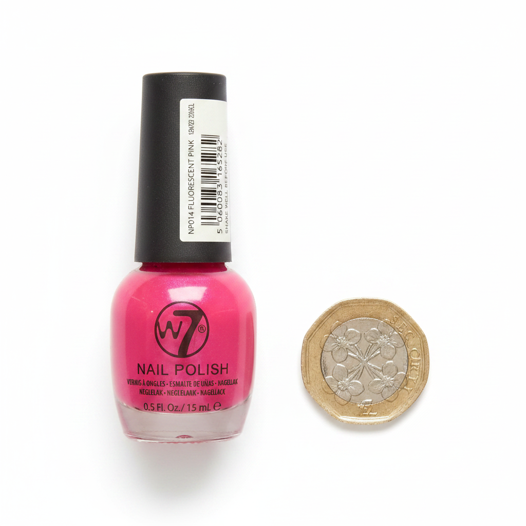 W7 Fluorescent Pink Nail Polish 15ml flat lay beside £1 coin for size reference, white background with soft overhead lighting