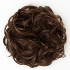 Extreme macro close-up of warm chestnut brown curly hair bun 6 Daylillies showing individual curl texture, toffee caramel undertones and strand craftsmanship