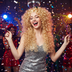 Woman wearing long blonde curly wig dancing at a fancy dress party with confetti and colourful lights