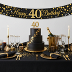 Elegant 40th birthday party table with Sparkling Fizz banner and black gold decorations