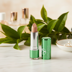 W7 Tea Tree Concealer Stick Medium Deep with natural tea tree leaves and marble background