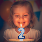 Child's joyful face glowing with excitement at a birthday cake with Blue Number 2 Candle - Why Not Shop