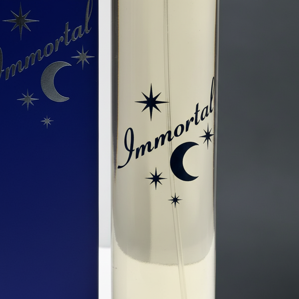 Extreme macro close-up of Immortal EDP clear glass bottle texture, chrome silver cap and dark navy moon and stars branding