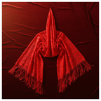 Red lace pashmina shawl draped on velvet background showing floral lace detail and tassel fringe