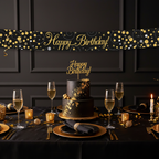 Sophisticated birthday party table with black and gold theme and Sparkling Fizz banner
