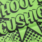 Extreme macro close-up of neon lime green whoopee cushion rubber texture and black starburst graphic print detail