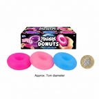 Squidgy Donut In Box flat lay with three squishy donut toys beside a £1 coin to show scale on white background