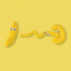 Three Squeeze & Stretch Stress Relief Banana toys in different poses