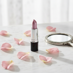Laval Lipstick Tawny No 37 styled on marble vanity with pink rose petals and natural window light