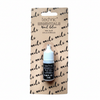 Technic Essentials Clear False Nail Glue 2ml in blister pack — studio hero shot on pure white background showing black bottle with white cap and sandy kraft card packaging