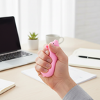 Adult using stretchy pig stress reliever on office desk - workplace stress relief