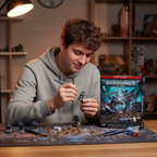 Hobbyist painting Warhammer 40,000 miniatures from the Introductory Set