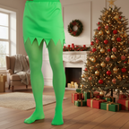 Man's legs in bright green elf tights beside a decorated Christmas tree in a cosy living room with natural window light