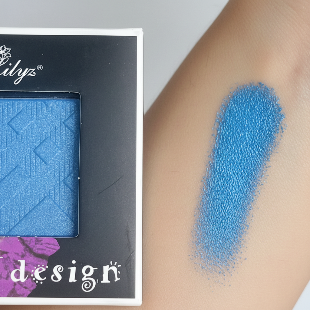 Close-up of Lilyz Eyeshadow Mono Electric Blue pigment with vivid colour swatch on skin