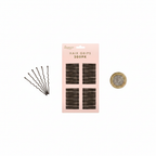 Glamorize Hair Grips blush pink packaging flat lay on white background beside a UK £1 coin for scale, with loose brown bobby pins