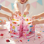 Children excitedly reaching for fairy party bags filled with colorful treats and toys at birthday celebration