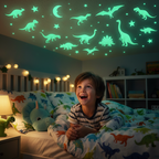 Young boy lying on bed looking up in wonder at glow in the dark dinosaur stickers glowing green on bedroom ceiling