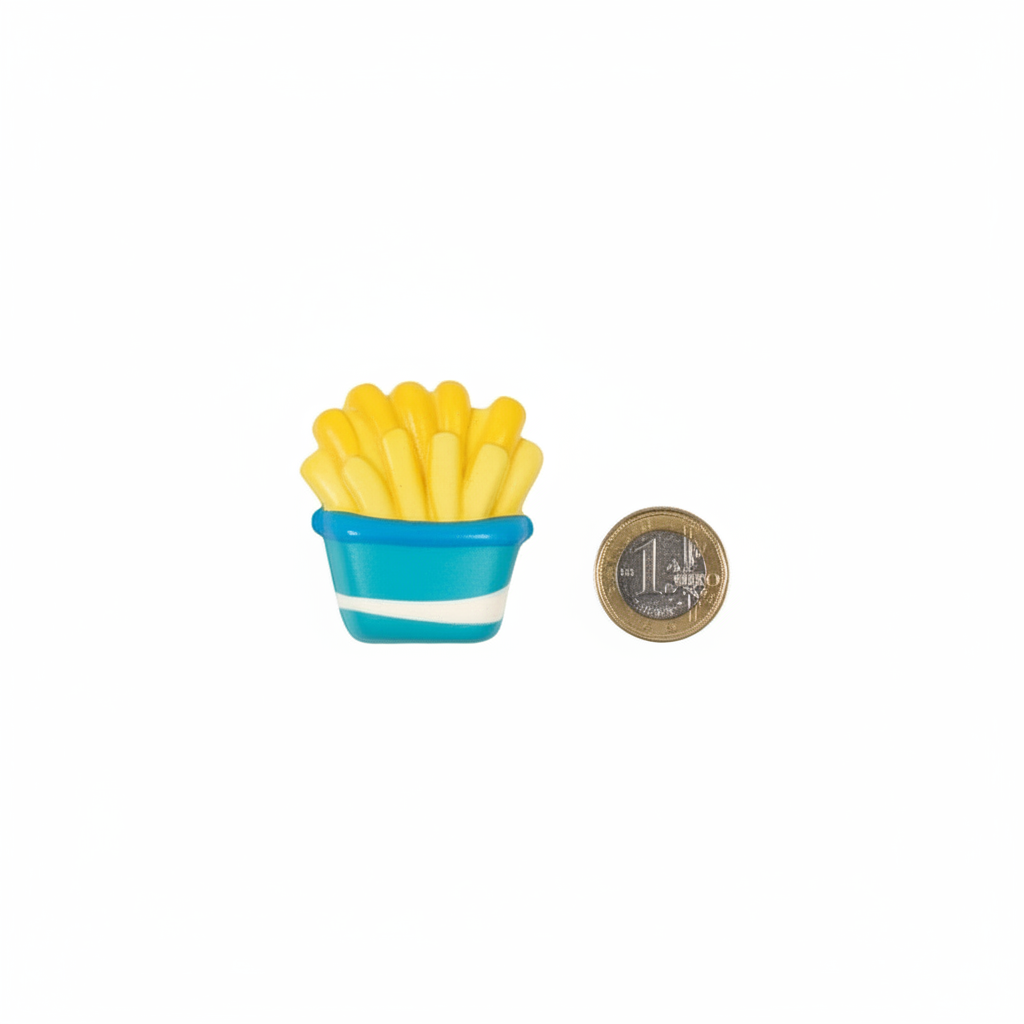 Squishy fast food toy beside a £1 coin showing 5cm compact size on white background