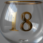 Extreme macro close-up of gold Art Deco 18th etching on clear glass, raking side light revealing craftsmanship detail