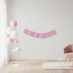 Pink Glitz 1st Birthday banner displayed in beautifully decorated party room