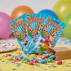 Three Funnyman Supersonic Sour Sweets blue blister cards fanned out on kids birthday party table with sweets and confetti
