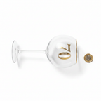 Art Deco 70th Birthday Gin Glass flat lay beside a £1 coin to show scale on white background