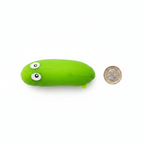 Stretchy Squishy Crazy Cucumber lime green squishy toy beside a £1 coin showing product size on white background